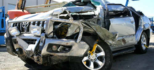 The hood of the Toyota Prado was crushed after the car rolled several times on May 22, 2010. The hood of the Toyota Prado was crushed after the car rolled several times on May 22, 2010.